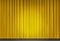 Yellow velvet curtain in theater with spot of light