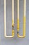 Yellow vertical metal pipes