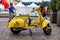 Yellow Vespa in Vespa Moto Fest in Turin City Center