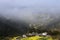 Yellow and villages on the hillside in spring, the mountain fog cover