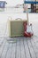 Yellow vintage guitar aplifier with cable and red electric guitar