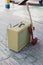 Yellow vintage guitar aplifier with cable and red electric guitar