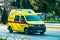 Yellow volkswagen ambulance driving on the street of Split, Croatia during the corona virus outbreak