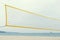 Yellow volleyball net on a sea shore Summer time No people