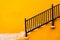 A yellow wall with stairs.