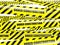 Yellow warning caution ribbon tape on white