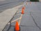 Yellow warning cones on an asphalt parking lot during the daytime