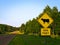 Yellow Warning Road Signs on a gravel rural country roadside