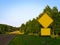 Yellow Warning Road Signs rural roadside in Minnesota at dusk