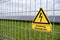 yellow warning sign Solar farms, capturing solar energy through photovoltaic panels, which contain solar cells convert sunlight