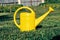 Yellow watering can close-up. Tool for irrigation of vegetables and plants. Agriculture. Selective soft focus