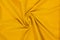 Yellow wavy fabric in a spiral shape