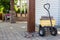 Yellow wheelbarrow loaded with paving bricks