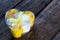 Yellow and white flowers roses in the shape of a heart. Wrapped Gift. Love