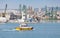 Yellow and white pilot boat enters the port