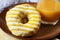 Yellow-white striped donut with juice