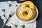 Yellow-white striped donuts on white lacy