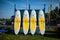 Yellow and white surfboards stand on the beach.