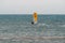 Yellow windsurf  Riding the Waves in a Choppy Sea