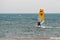 Yellow windsurf  Riding the Waves in a Choppy Sea