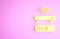Yellow Wireless multimedia and TV box receiver and player with remote controller icon isolated on pink background