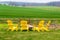 Yellow Wooden Chairs Around Fire pit in field