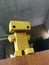 yellow wooden toy mini robot