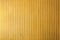 Yellow wooden vertical thin strips wall