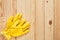 Yellow worker gloves at wooden background
