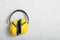 Yellow working protective headphones noise muffs