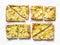 Yellow zucchini puff pastry mini tarts on a light background, top view. Tasty snack, tapas