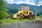 Yellowgrader on mountainous road construction