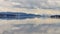 Yellowstone Lake late April with snowy mountains.