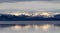 Yellowstone Lake with snow covered mountains in American Landscape