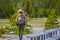 YELLOWSTONE, MONTANA, USA MAY 24, 2018: Outdoor view of female park ranger wearing a green uniform with a backpack