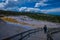 YELLOWSTONE, MONTANA, USA MAY 24, 2018: Unidentified woman walking at Canary Springs on terraces of Mammoth Hot Springs