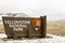 Yellowstone National Park sign at entrance in Wyoming in winter