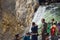 YELLOWSTONE NATIONAL PARK, WYOMING, USA - JULY 17, 2017: Organized group of tourists with a guide watching and taking pictures of