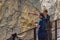 YELLOWSTONE NATIONAL PARK, WYOMING, USA - JULY 17, 2017: A tour guide points out, tells a tourist about Lower Yellowstone Falls. G