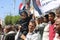 A Yemeni child participates in peaceful protests with the Yemeni flag