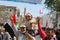 A Yemeni child participates in peaceful protests with the Yemeni flag