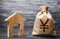 Yen yuan symbol money bag and house. Real estate purchase and investment. Affordable cheap loan, mortgage. Taxes, rental income