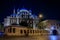 The Yeni Cami or New Mosque illuminated at night before sunrise, Istanbul Turkey
