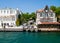 Yenikoy, Istanbul / Turkey -   Restaurant yard between abandoned  old wooden and luxurious maintained mansions  at Bosporus coast