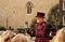 A Yeoman Warder dressed in period attire leads visitors on a tour through the Tower of London