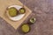 Yerba mate in calabash, porongo and two wooden bowls on stone background