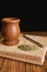 Yerba Mate tea in Argentina, wooden on black background