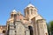 Yerevan, Armenia, September, 15, 2014. People walking near the Church of the Holy Catholike in Yerevan, 13th century, on the backg