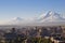 Yerevan, capital of Armenia at the sunrise with the two peaks of the Mount Ararat on the background.