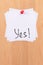 YES! - White Sticky Notes with Written Word YES, Pinned to the Wooden Message Board